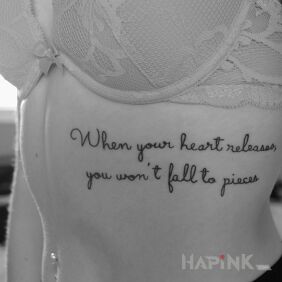 Tattoo Slowing down the heart on the ribs motif: lettering style: calligraphy