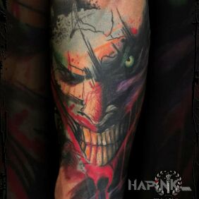 Tattoo Joker on the forearm motif: colorful style: graphic / illustrative