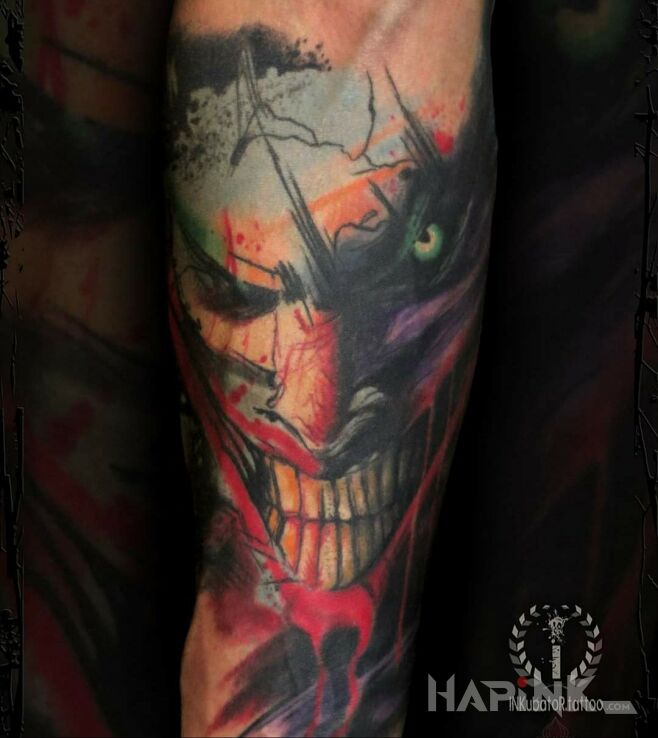 Tattoo Joker in colorful motif and graphic / illustrative style on the forearm