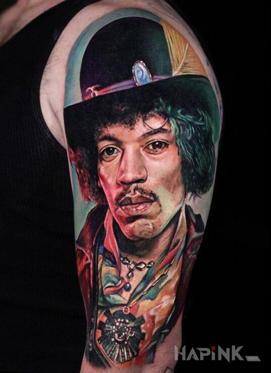 Tattoo Jimi Hendrix in characters motif on the upper arm