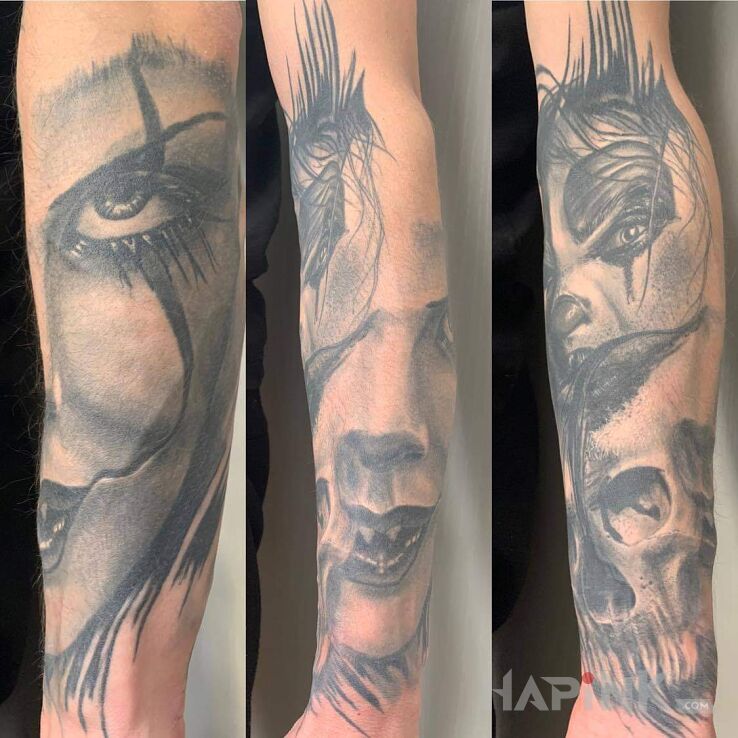 Tattoo Demony in demons motif and realistic style on the forearm