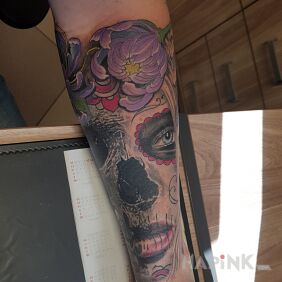 Tattoo Torn Muerta on the forearm motif: santa muerte style: graphic / illustrative
