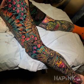 Tattoo Uniquely colored Indian on the leg motif: faces style: graphic / illustrative