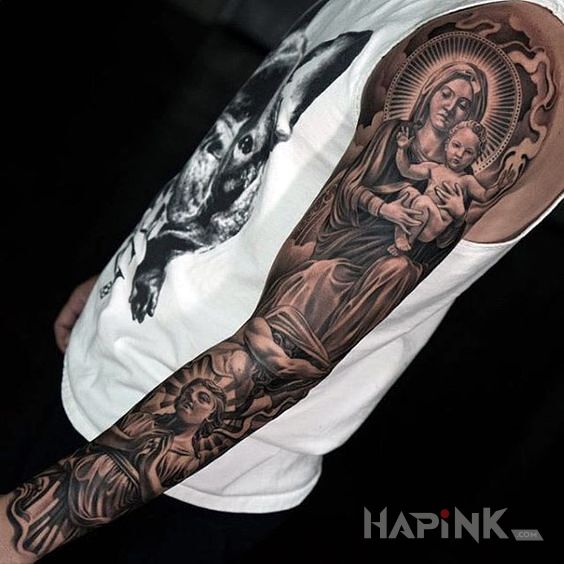 Tattoo Dzieciątko Jezus in sleeves motif and realistic style on the upper arm