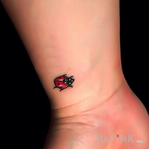Tattoo Mała biedra in colorful motif and minimalistic style on the wrist