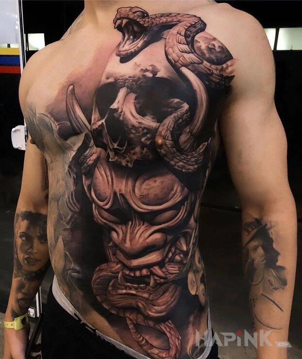 Tattoo Japoński demon in faces motif and realistic style on the ribs