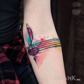 Tattoo Violin key on the forearm motif: colorful style: Watercolor