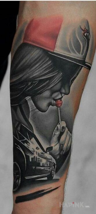 Tattoo Lolipop in faces motif and realistic style on the forearm