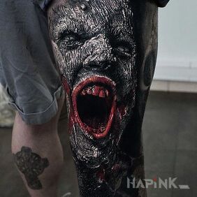 Tattoo A cry of despair on the leg motif: faces style: realistic