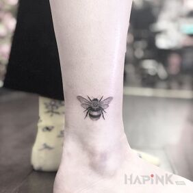 Tattoo Bee near the ankle motif: black and gray style: realistic