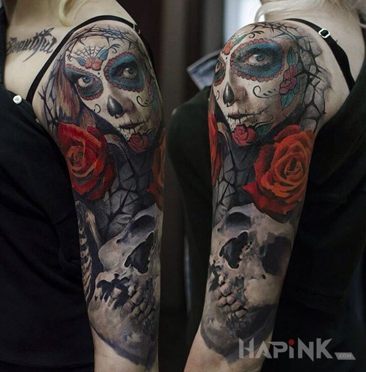 Tattoo Día de los Muertos in skulls motif on the upper arm