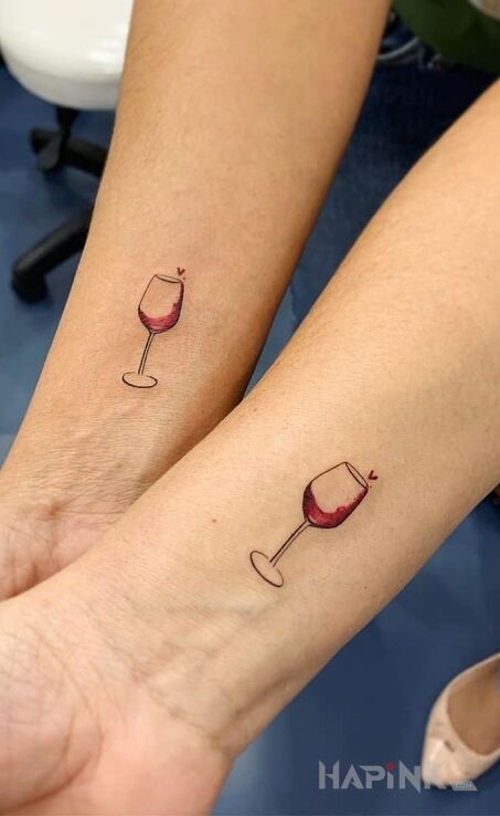 Tattoo Po kieliszku wina :) in colorful motif and minimalistic style on the wrist