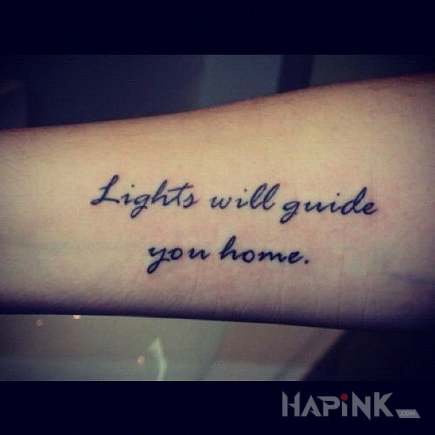 Tattoo Powrót do domu in lettering motif and calligraphy style on the forearm