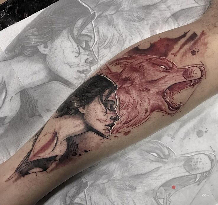 Tattoo Dziki zew in black and gray motif and graphic / illustrative style on the calf