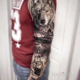 Tattoo Sea wolf on the upper arm motif: black and gray style: realistic
