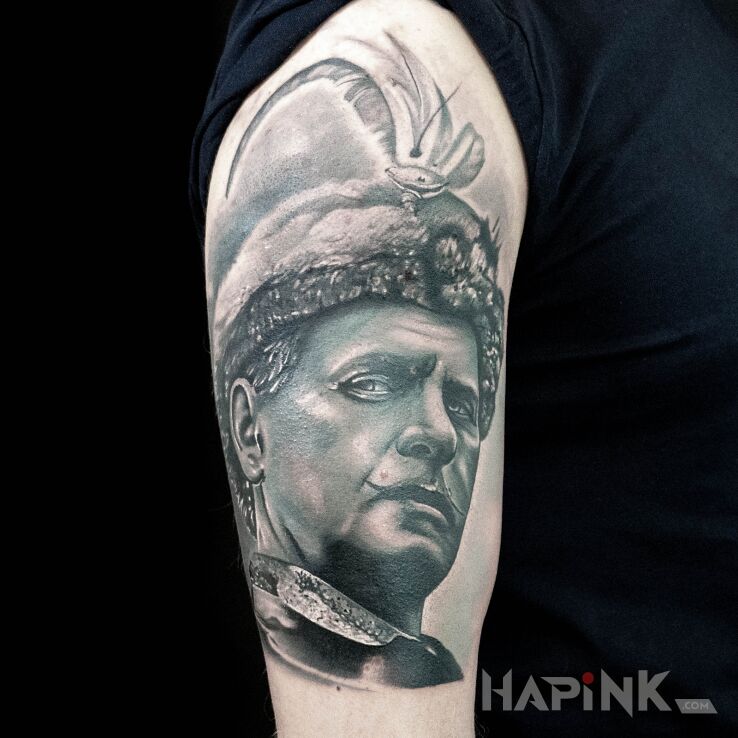 Tattoo Pan Wołodyjowski in characters motif and realistic style on the upper arm