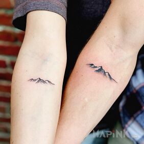 Tattoo Mountains not valleys on the forearm motif: nature style: minimalistic