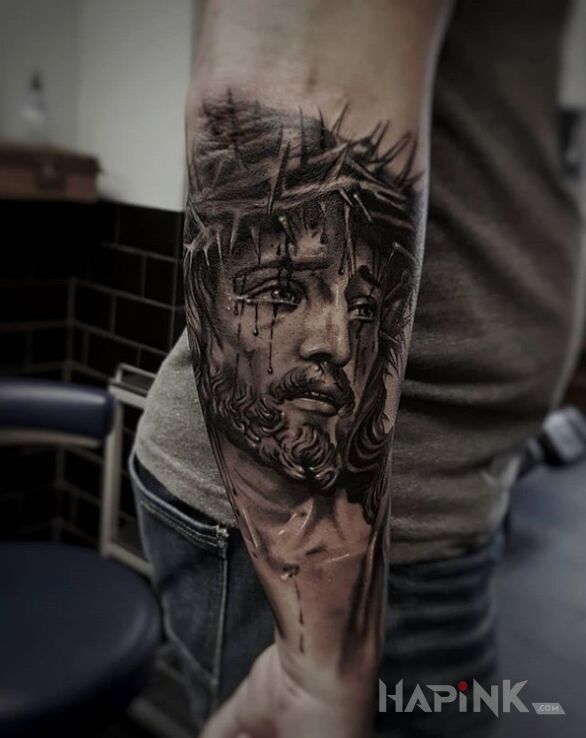 Tattoo Jezus w wykonaniu Matiego in black and gray motif and realistic style on the forearm