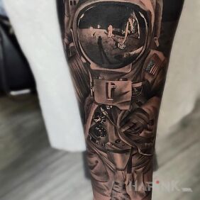 Tattoo Astronaut on the forearm motif: cosmos