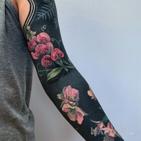 Tattoo Pink on black on the upper arm motif: colorful style: graphic / illustrative