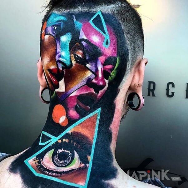 Tattoo Koloryt in faces motif and surrealistic style on the nape