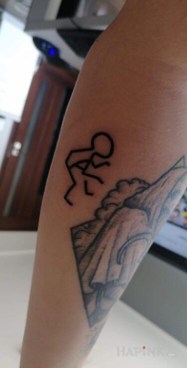 Tattoo Stickman wrestler in other motif and minimalistic style on the forearm