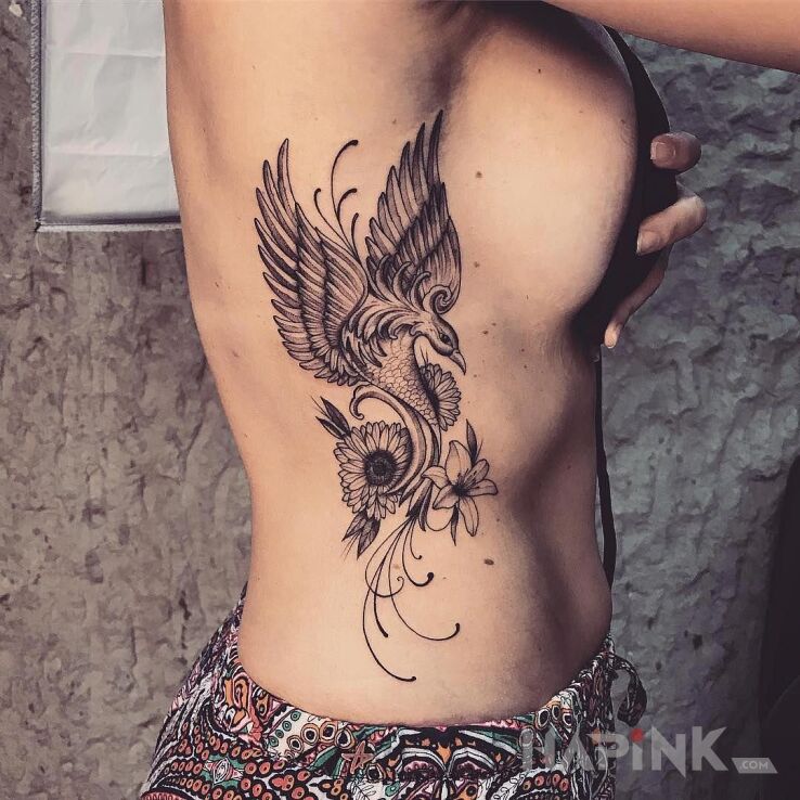 Tattoo Feniks in fantasy motif and graphic / illustrative style on the ribs