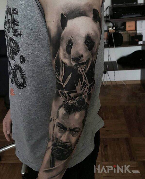 Tattoo Samuraj i panda in characters motif on the upper arm