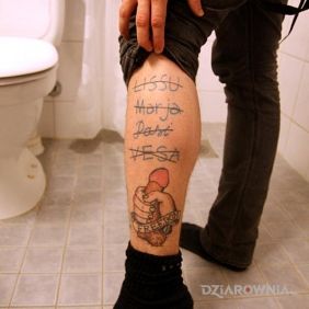 Tatuaż Wolność :) na nodze motyw: napisy