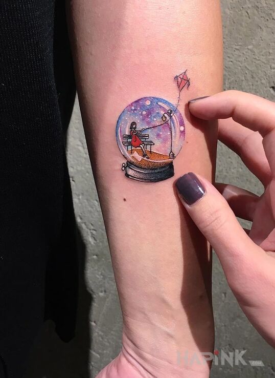 Tattoo Szklana kula in other motif on the forearm