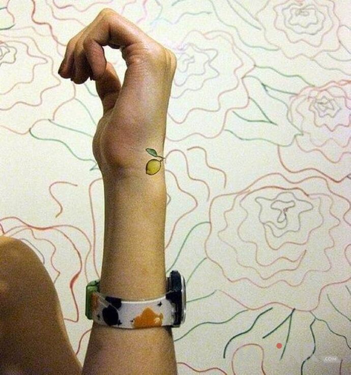 Tattoo Cytrynka in other motif and minimalistic style on the wrist