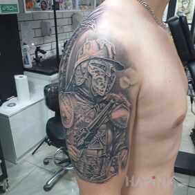 Tattoo Hussars on the upper arm motif: black and gray style: realistic
