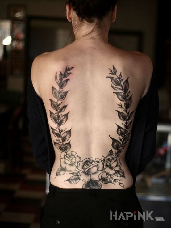 Tattoo Wieniec in flowers motif and graphic / illustrative style on the back