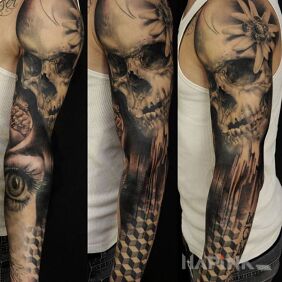 Tattoo Skull with flower on the forearm motif: sleeves style: geometric
