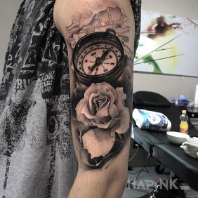 Tattoo Compass and flower on the upper arm motif: 3D