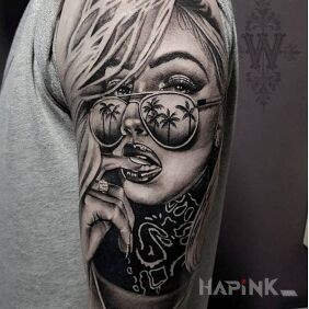 Tattoo Such a portrait on the upper arm motif: black and gray style: realistic