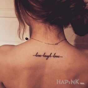 Tattoo What to do? on the back motif: lettering style: calligraphy