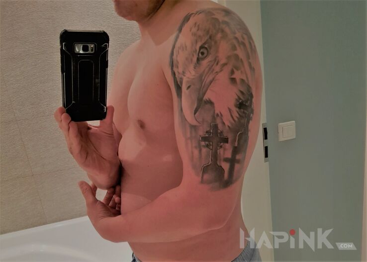 Tattoo Orzeł in black and gray motif and realistic style on the upper arm