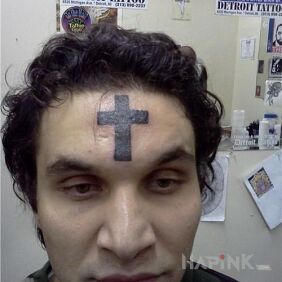 Tattoo Fanatic on the face motif: religious