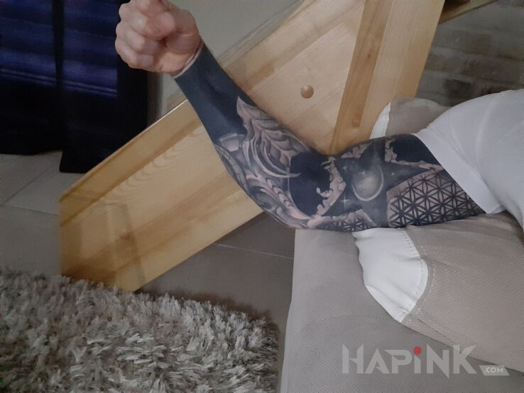 Tattoo Blackwork in sleeves motif and blackwork / blackout style on the upper arm