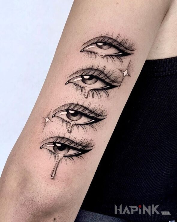 Tattoo Łezka in black and gray motif and graphic / illustrative style on the upper arm
