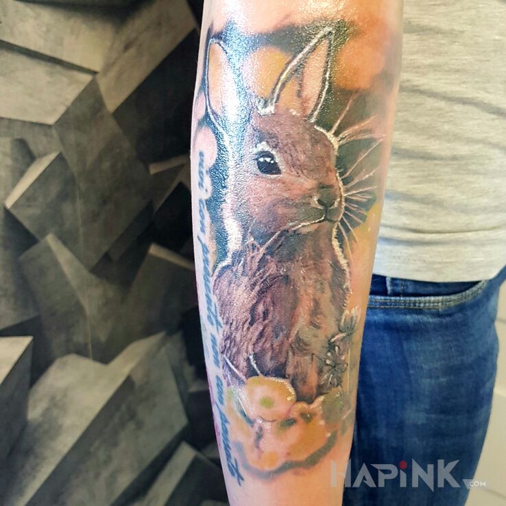 Tattoo Zajaczek in colorful motif and realistic style on the forearm