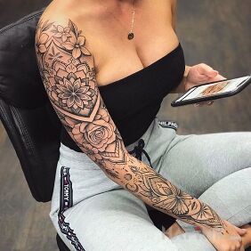 Tattoo Flowers and mandalas on the upper arm motif: ornaments style: graphic / illustrative