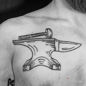 Tattoo Anvil on the chest motif: black and gray style: contour / linework