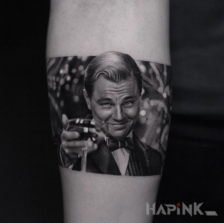 Tattoo Wielki Gatsby in faces motif and realistic style on the forearm