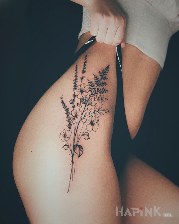 Tattoo Kwiatuszki in black and gray motif and graphic / illustrative style on the leg
