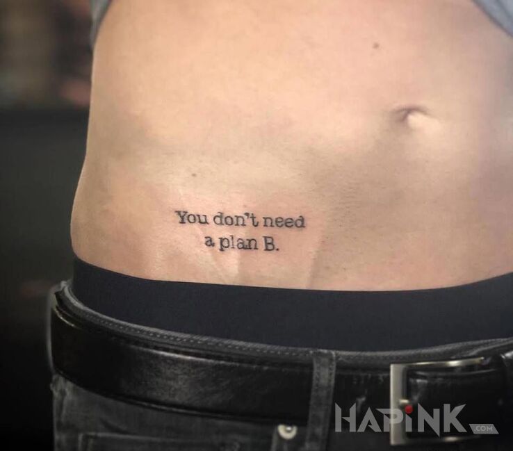 Tattoo Tylko plan A in lettering motif and calligraphy style on the stomach