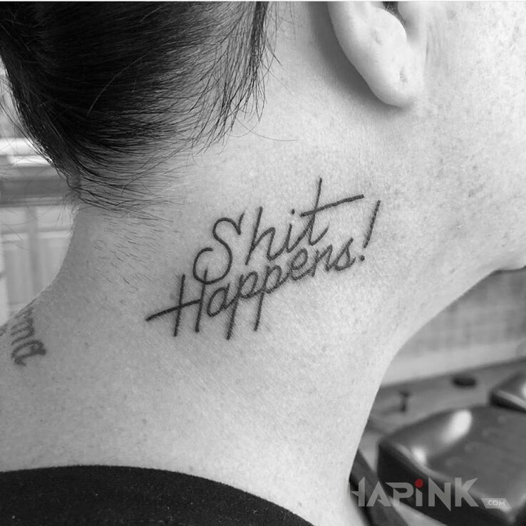 Tattoo Shit happens! in lettering motif and calligraphy style on the neck