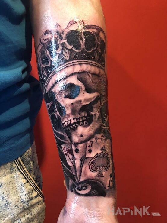 Tattoo Czacha in objects motif and realistic style on the forearm