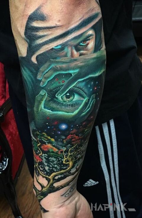 Tattoo Mistyk in colorful motif and realistic style on the forearm